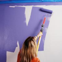 woman painting a wall