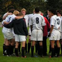 sports team in a huddle