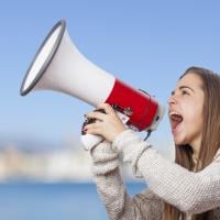 Woman yelling into a megaphone