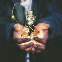 Man holding a light bulb