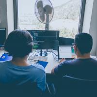 Two people practicing pair programming