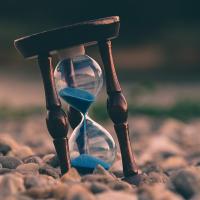 Sand falling through an hourglass