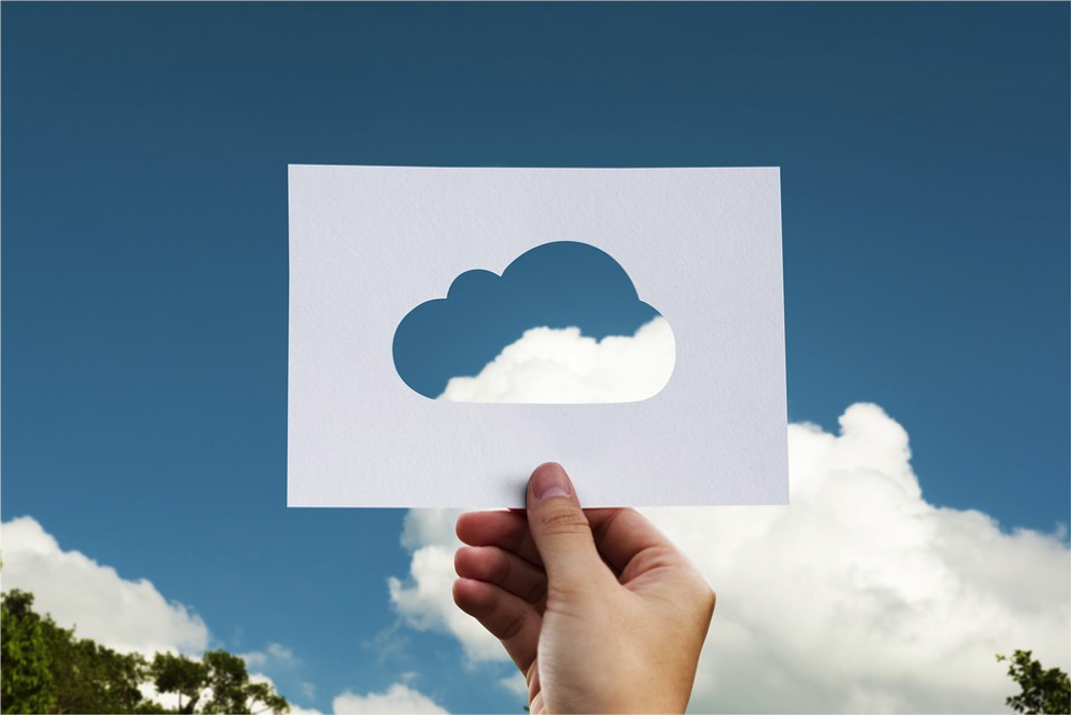 Person holding up a picture of a cloud