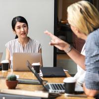 Team members having a productive conversation in a meeting