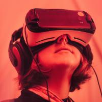 Person wearing VR headset, photo by Samuel Zeller