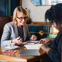 Woman meeting with her new boss to get to know her