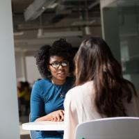 Woman being interviewed for a job as a software tester