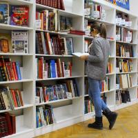 Person browsing at a bookstore