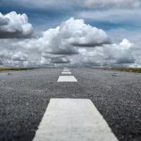 Road leading toward clouds