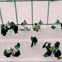 Groups of people networking at a conference