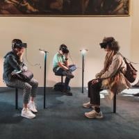 People wearing virtual reality headgear