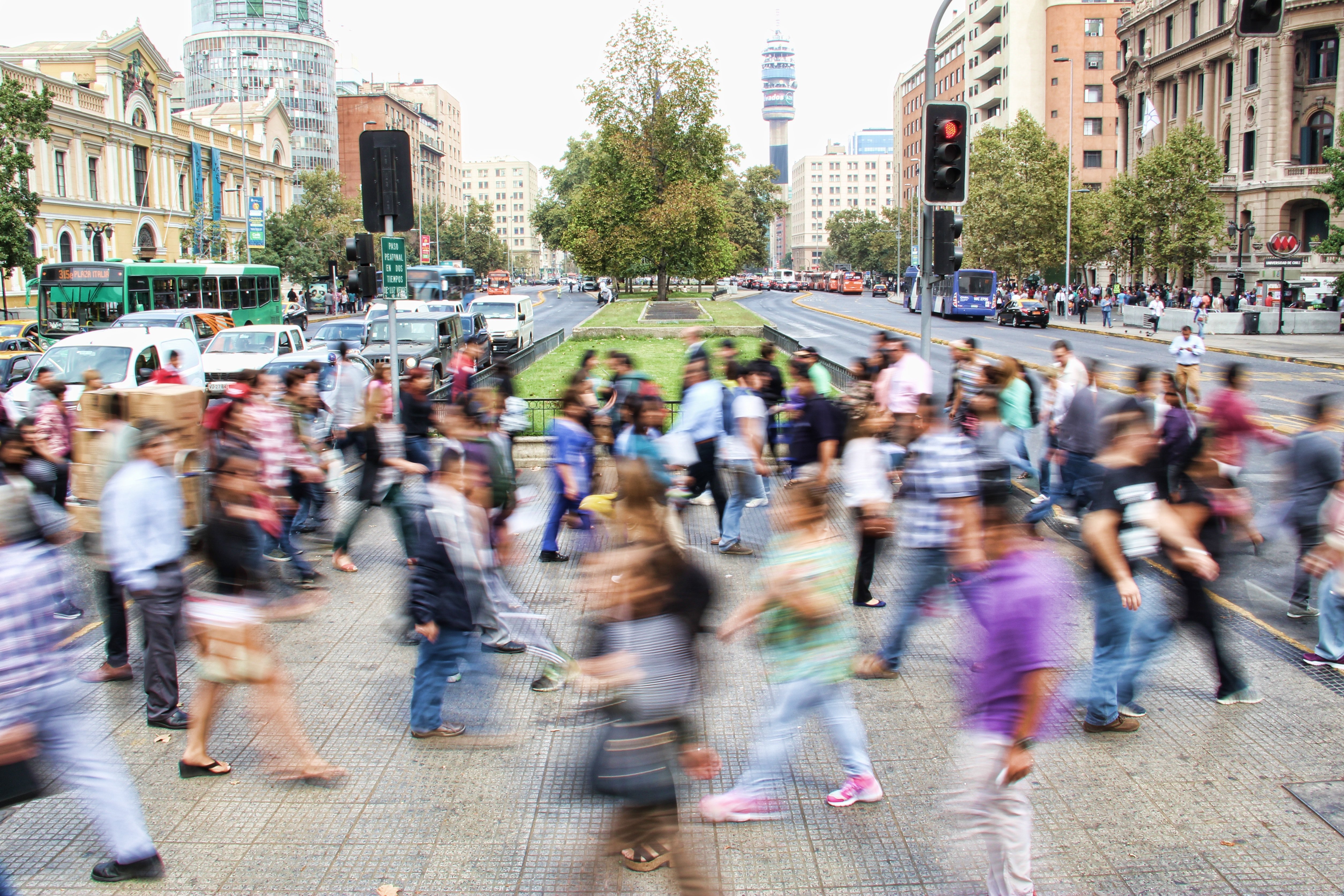 A crowd of people walking in the street