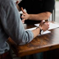 A manager and employee having a one-on-one meeting