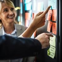 Agile team members refining the product backlog