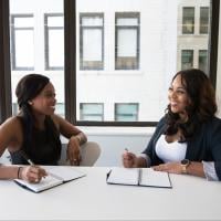 A manager and an employee having a one-on-one meeting