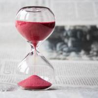 Sand running through an hourglass