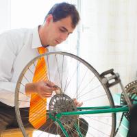 Scrum team member fixing a bicycle