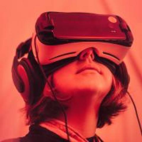 Person wearing VR headset, photo by Samuel Zeller
