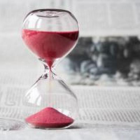 Sand running through an hourglass