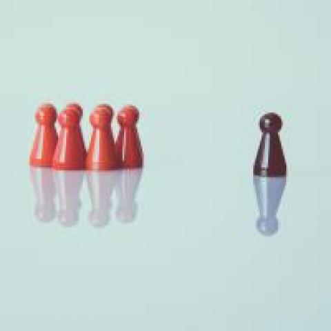 Game pieces with a leader facing the other pieces