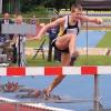 man jumping hurdle