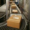 Conveyor belt delivering boxes