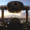 Binoculars over cityscape