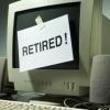 Computer with "Retired!" sign