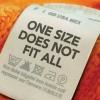 Shirt tag saying "One size does not fit all"