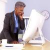 Woman standing up from desk