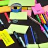Many brightly colored sticky notes and markers on a table, photo by Frans Van Heerden