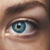 Close-up photo of someone's blue eye, by Amanda Dalbjörn