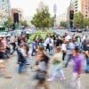 A crowd of people walking in the street