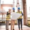 architects holding a blueprint