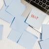 post-it notes scattered on a laptop